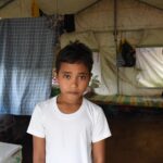 Earthquake affected Josue talks about his life in a tent and his Christmas hopes