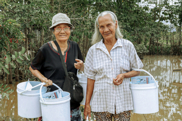 World Vision distributes water purifier packets to flood-affected families in...